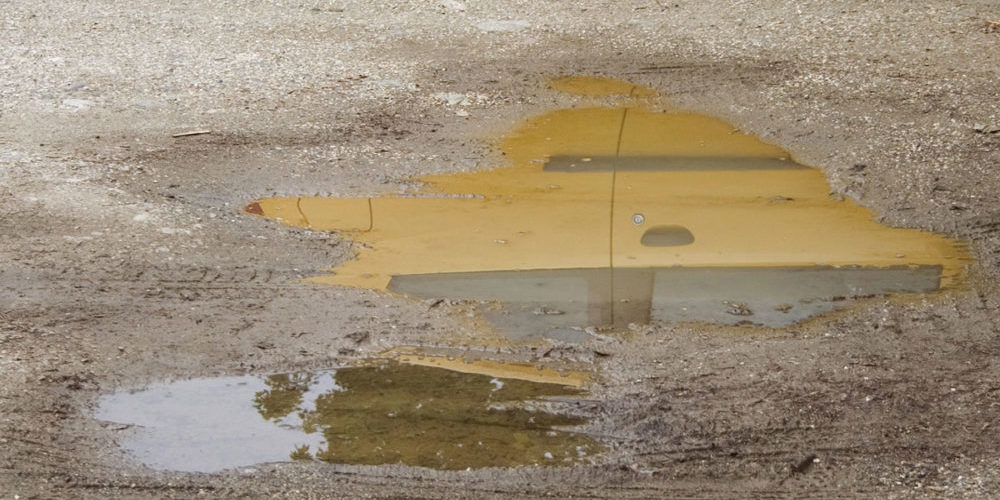 Parkplatz mit Schlaglöchern